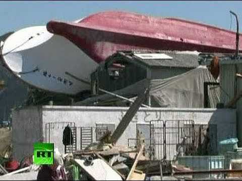 Japan Tsunami Havoc: Ship on roof, car graveyard, ruined homes